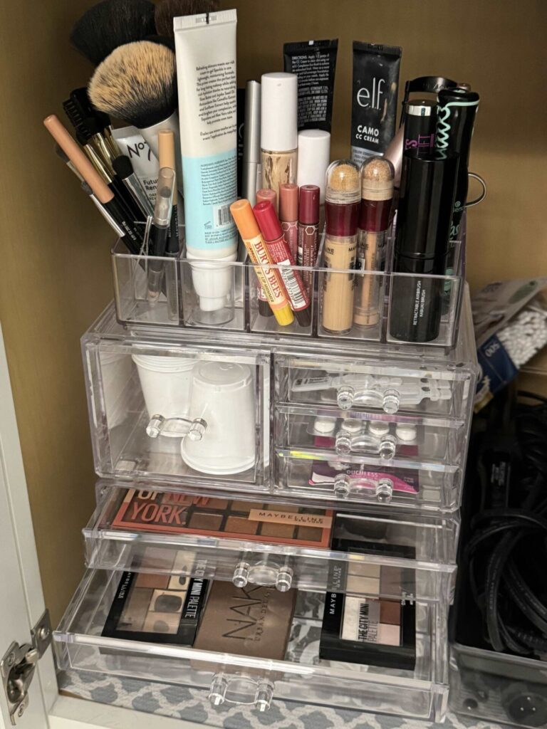 Makeup in an acrylic stacked organizer. 