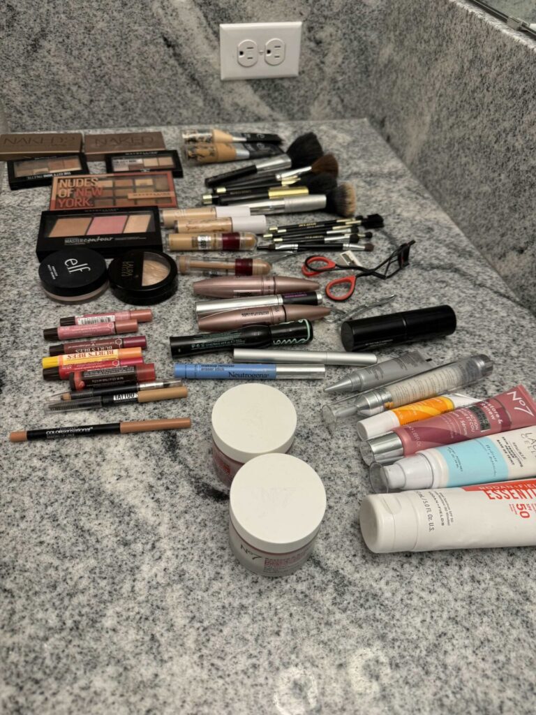 Step one to organize makeup is to lay it all out on a counter. 