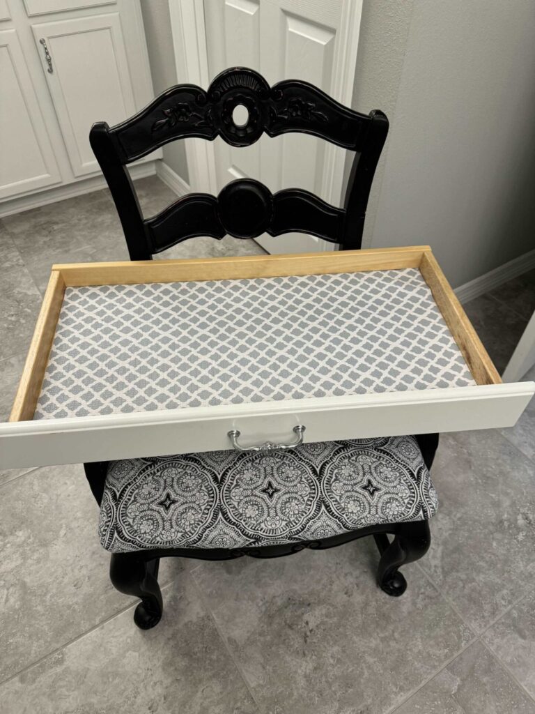 Step five to organize makeup is to add shelf liner to a drawer. 