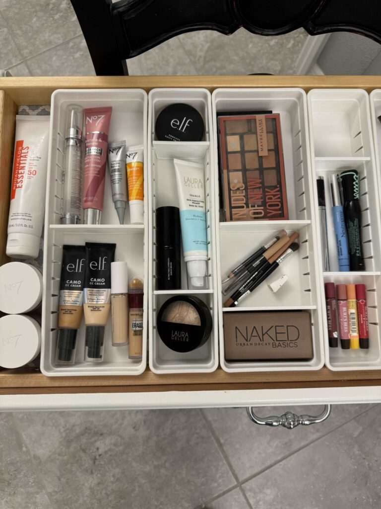 Makeup arranged in divided trays. 