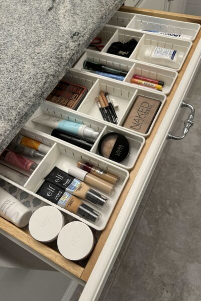 Makeup organized in a drawer.