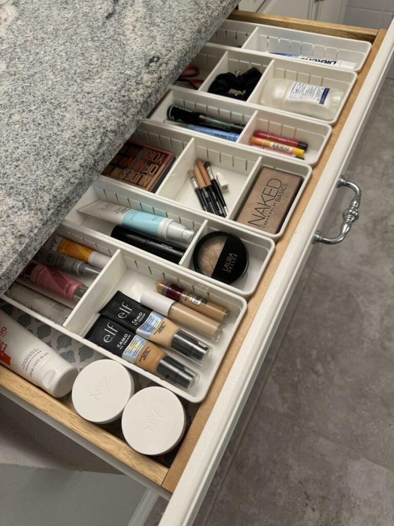 A drawer organized with divided trays.  