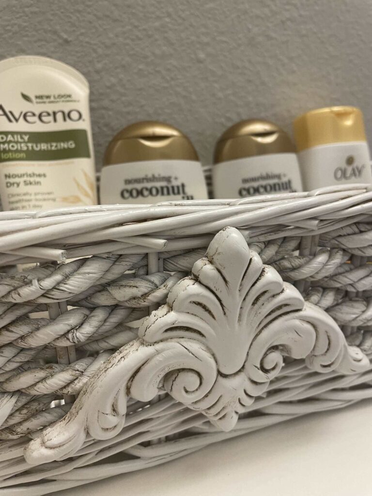 A white basket filled with toiletries. 