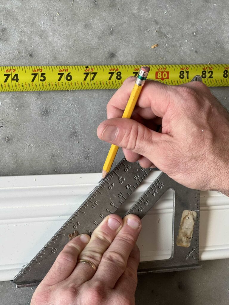 Step one to upgrade a bathroom mirror is to measure your trim. 