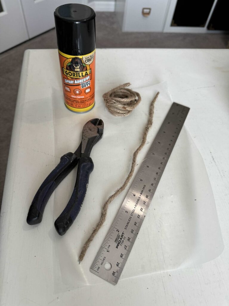 Spray adhesive, wire cutters, a ruler, and wired jute twine. 