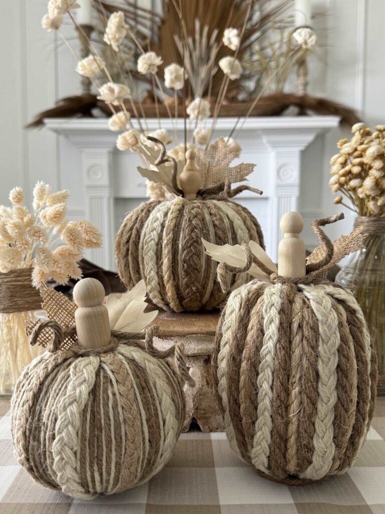 Three DIY rope and twine pumpkins.