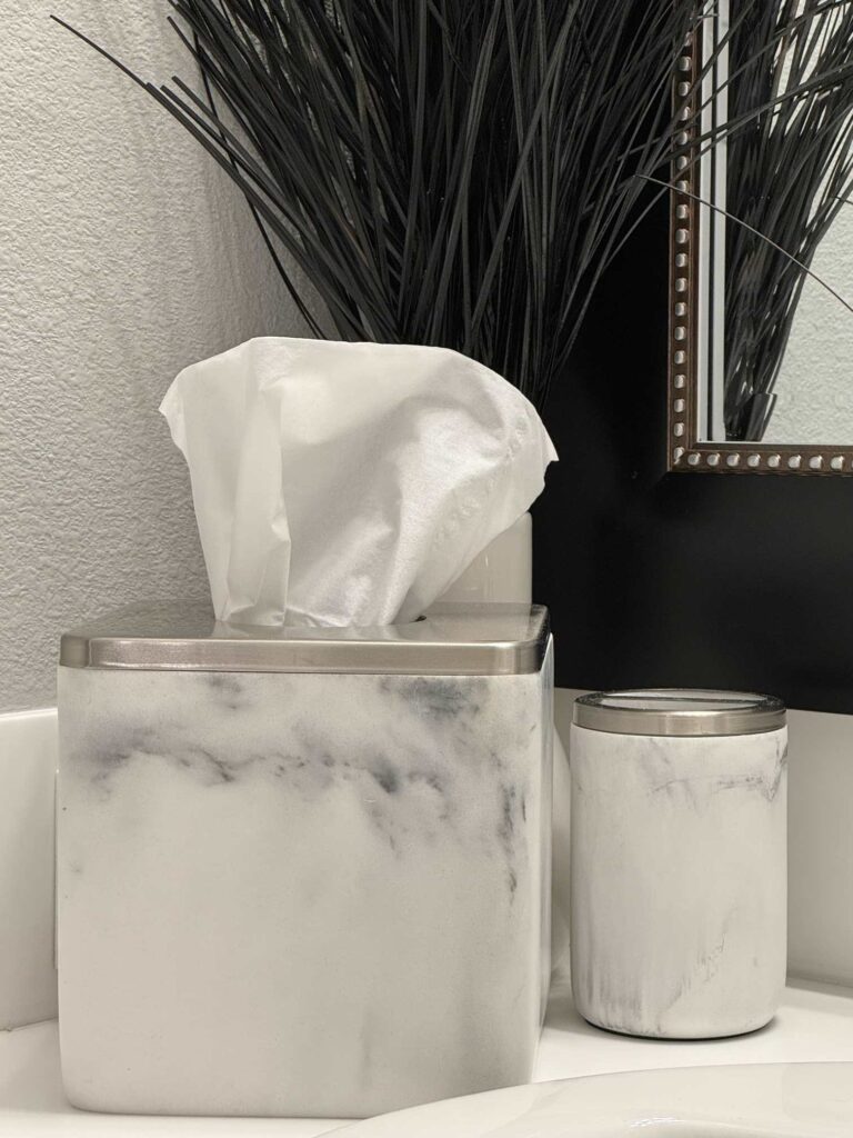 Marble tissue box cover and toothbrush holder. 