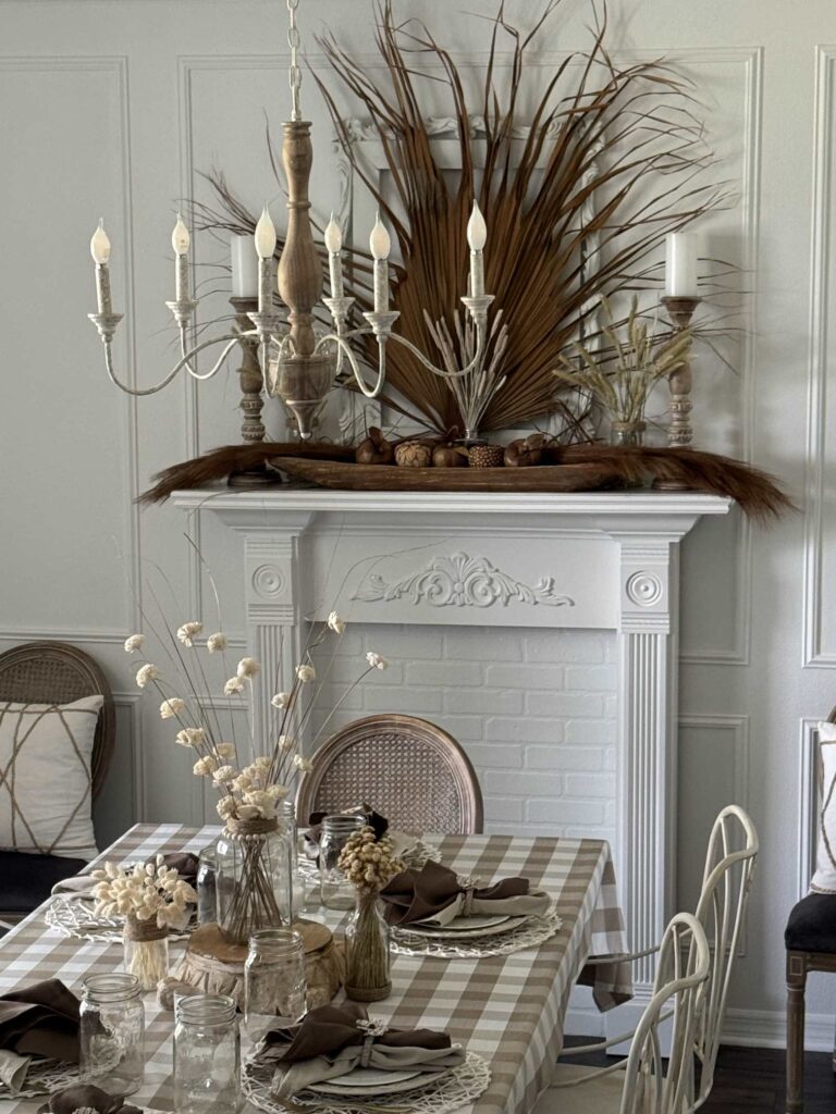 Early fall decorating in a white dining room with brown accents.