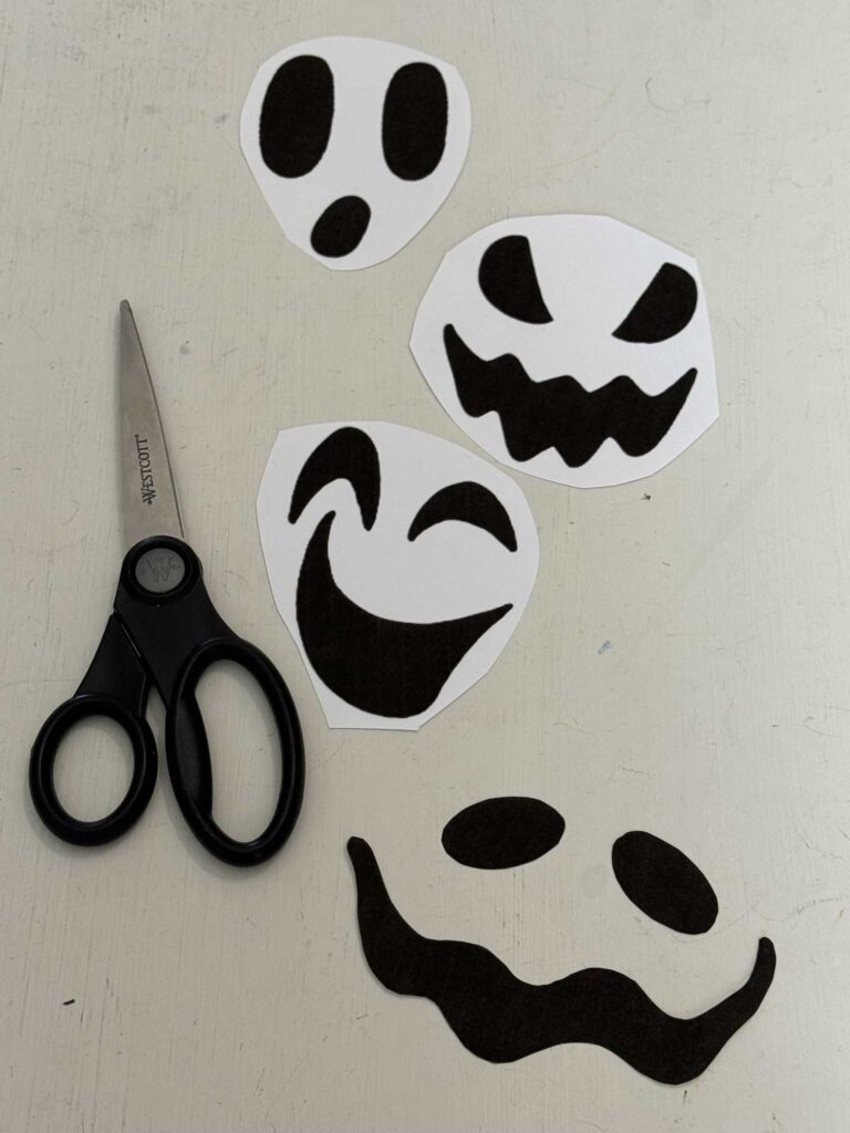 Printed faces and scissors.