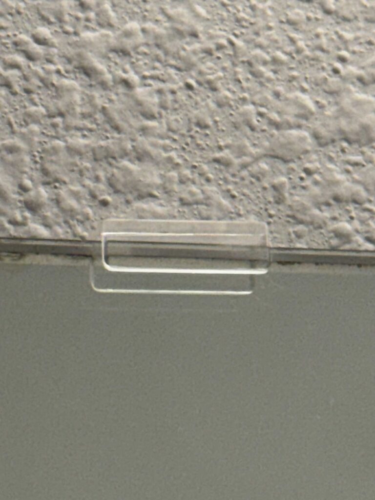 A plastic mirror clip. 