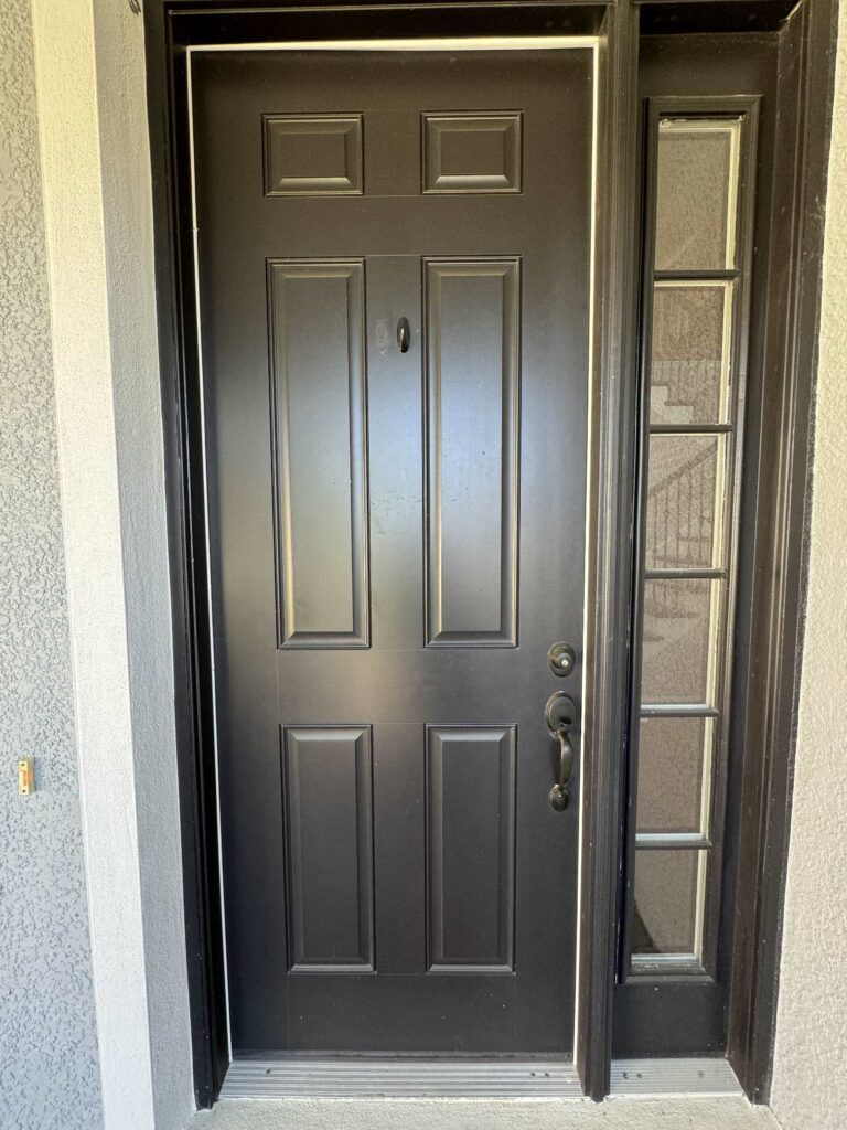 A black front door. 