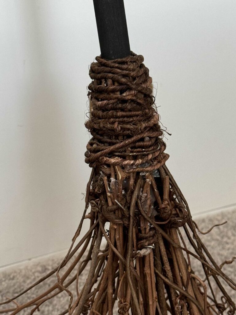 Wired jute cord wrapped around a broom handle. 