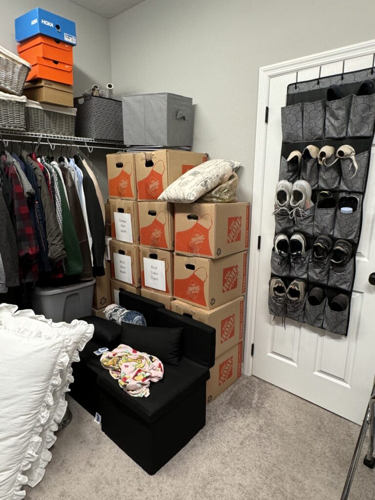 A cluttered walk-in closet.