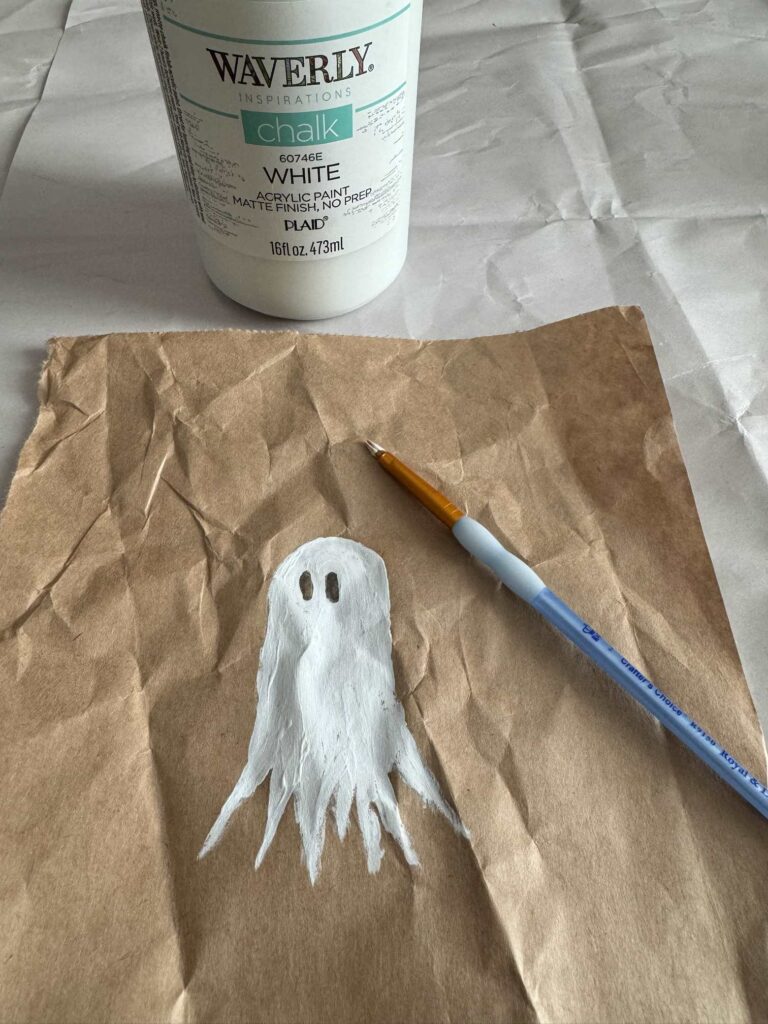 A ghost painted white with black eyes.