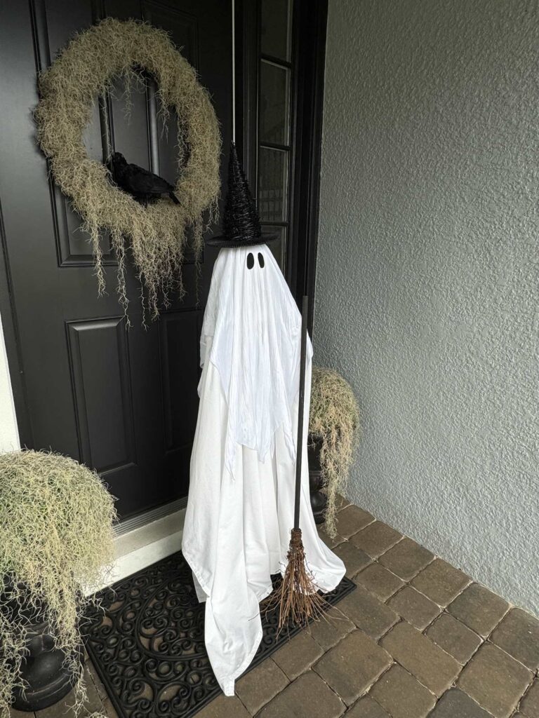 A DIY ghost dressed up like a witch! 