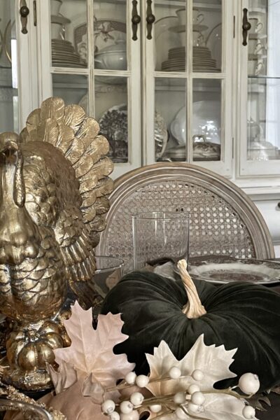 A gold turkey on a Thanksgiving table