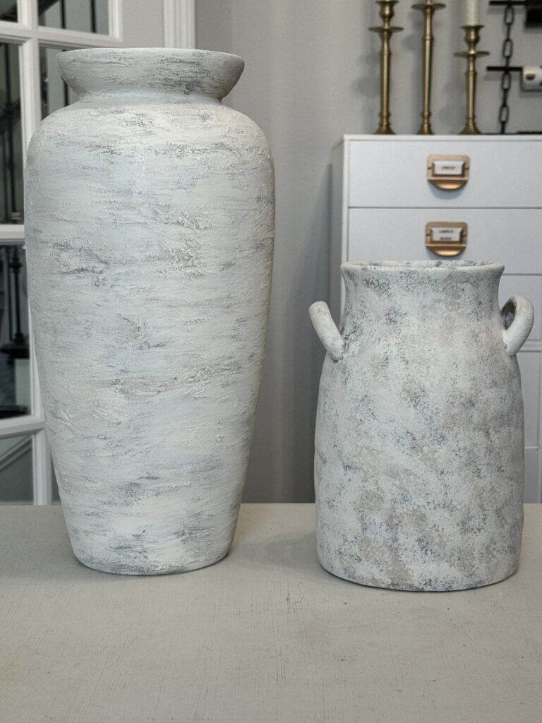 Two coordinating painted vases. 