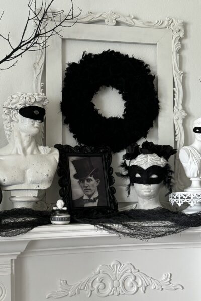 black and white mantel decorated for Halloween