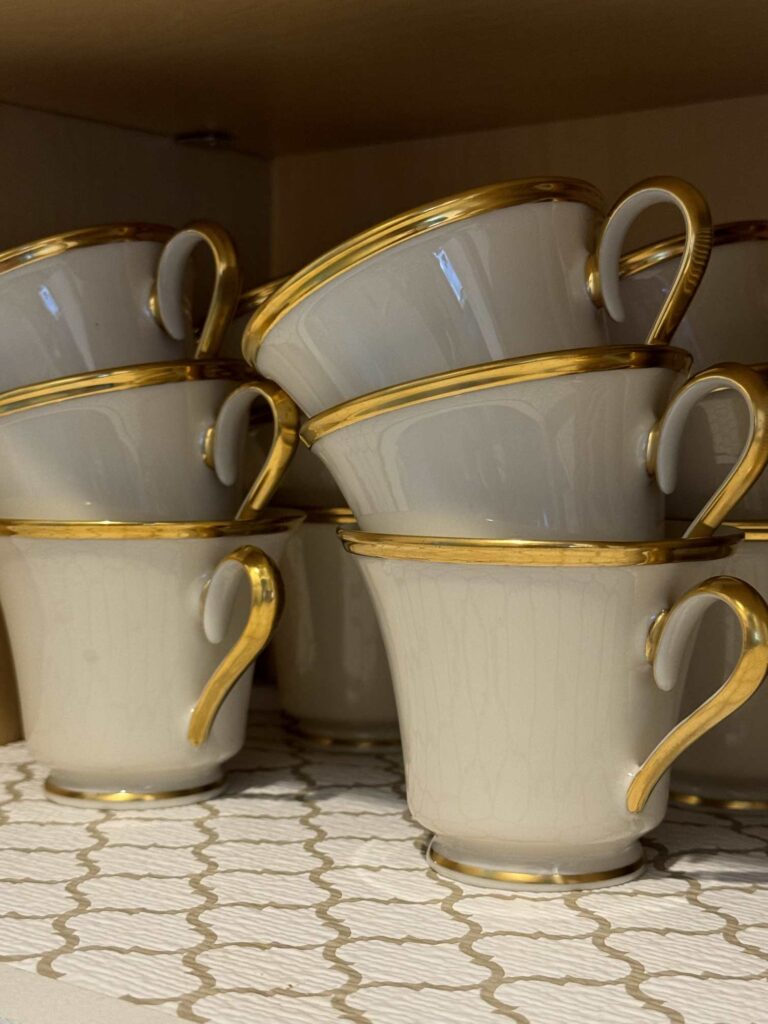 China cups stacked in a cabinet. 