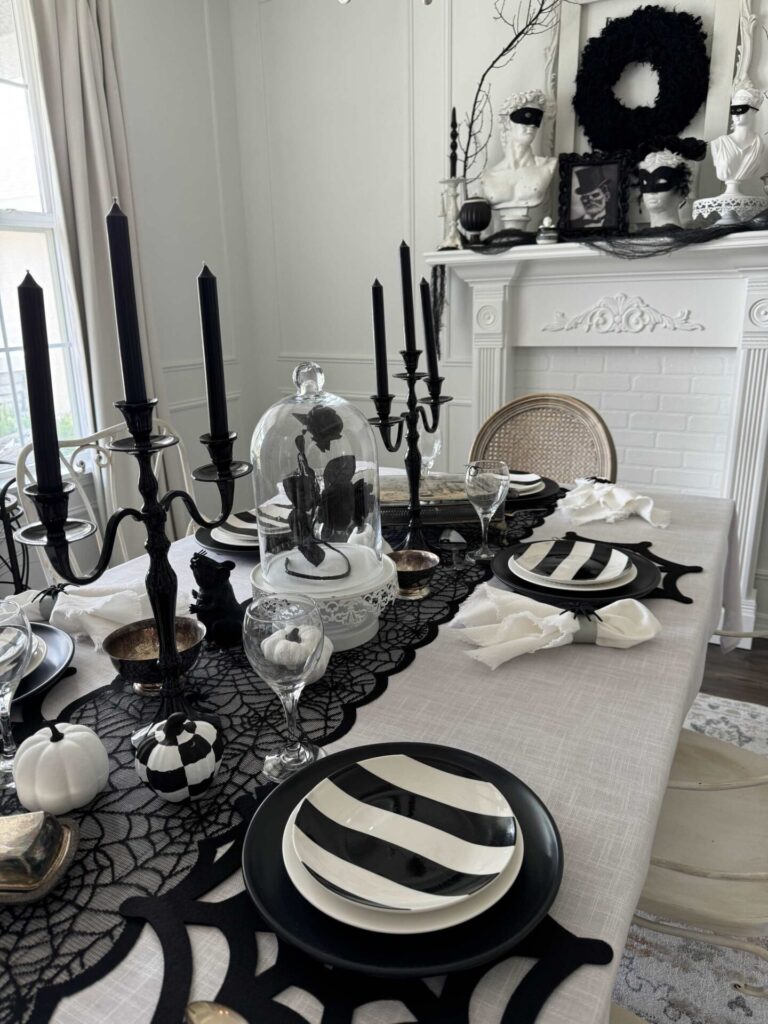 Dining room with a black and white Halloween tablescape. 