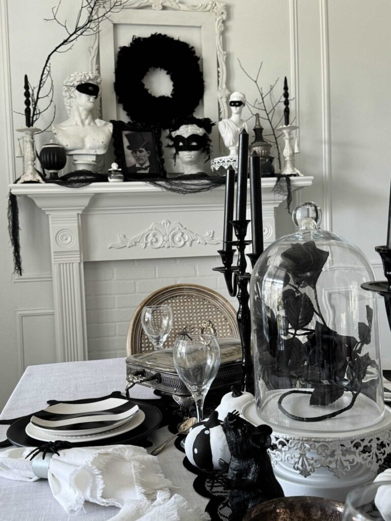 A mantel in a dining room decorated for Halloween. 