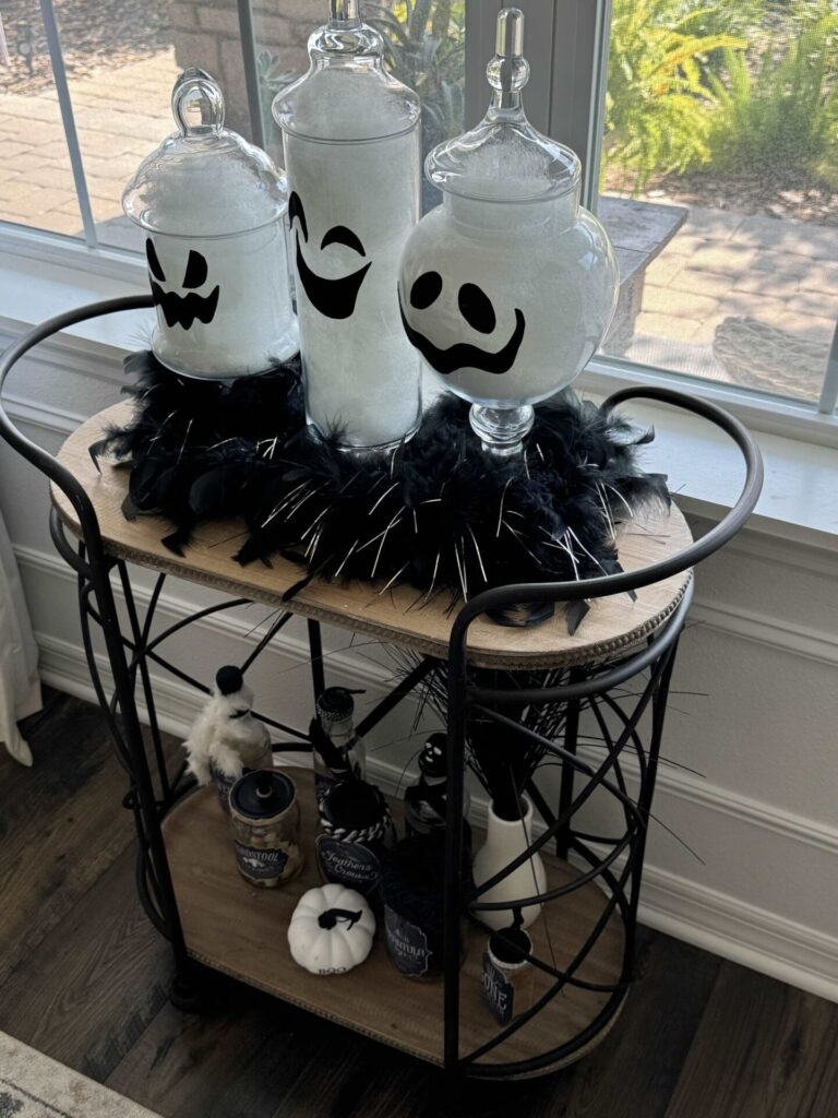 Ghost apothecary jars on a bar cart. 