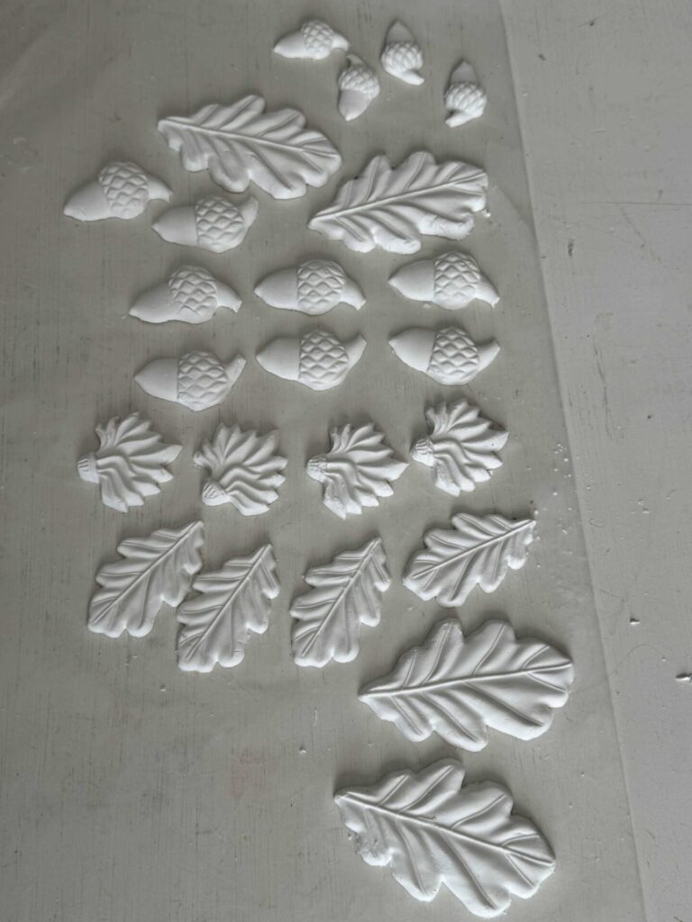 Air dry clay leaves and acorns.