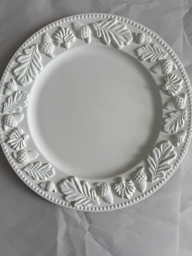 A charger plate painted white. 