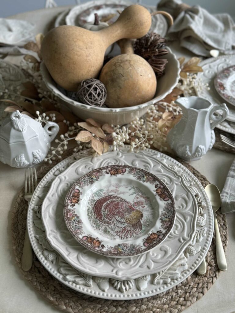 A DIY charger plate holds a Thanksgiving table setting. 