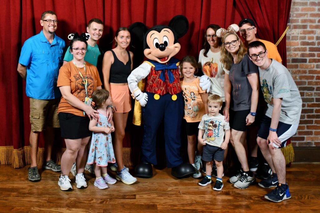 A family with Mickey Mouse. 