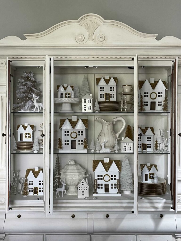 China cabinet decorated for Christmas. 