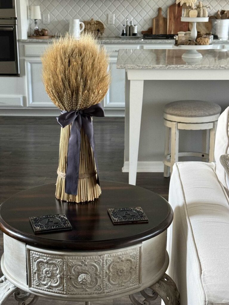 A dried wheat arrangement on a table. 