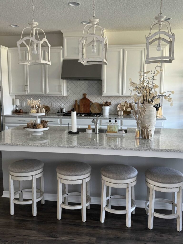 A white kitchen decorated for a Fall home tour. 