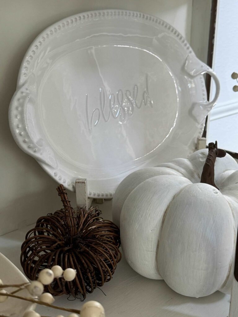 White platter with the word "blessed" on it. 