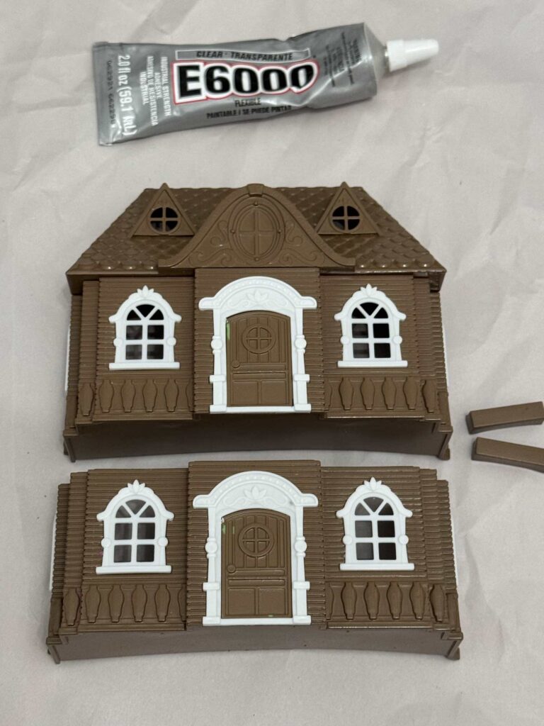 Painted houses and E6000 glue. 