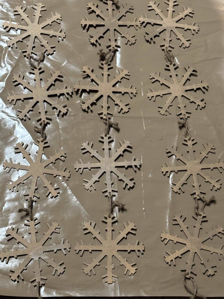 Spraypainted wood snowflake garlands. 