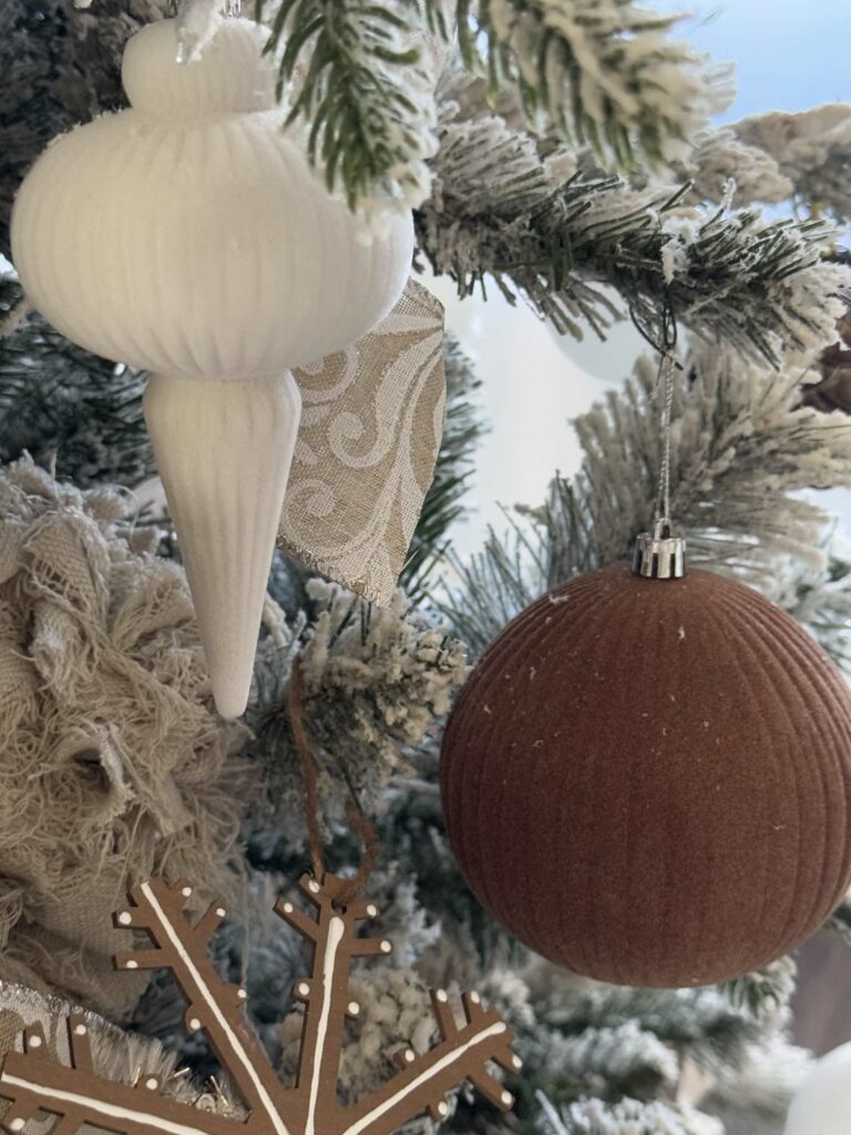 Brown and white flocked Christmas ornaments. 