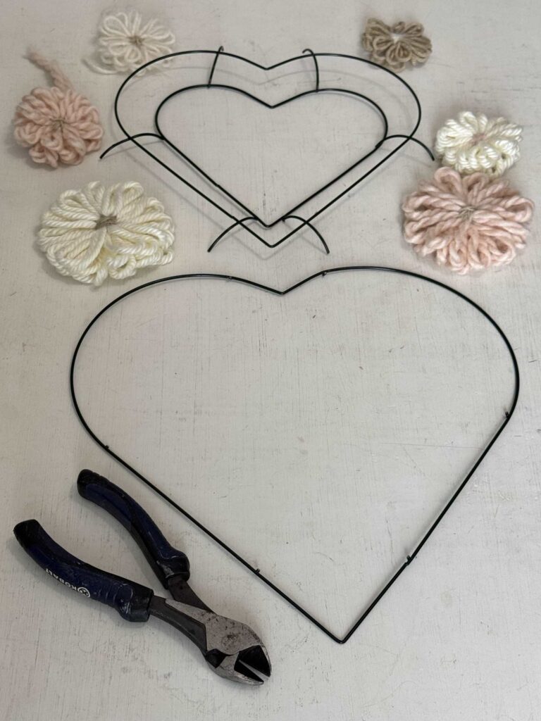 A heart wreath form that has been cut apart with wire cutters. 