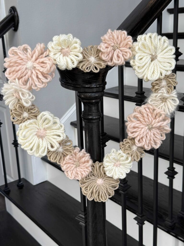 DIY Valentine's Wreath made with yarn flowers. 