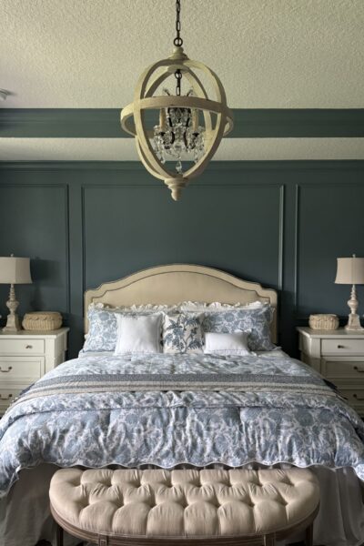 Blue and white bedroom with crown molding.