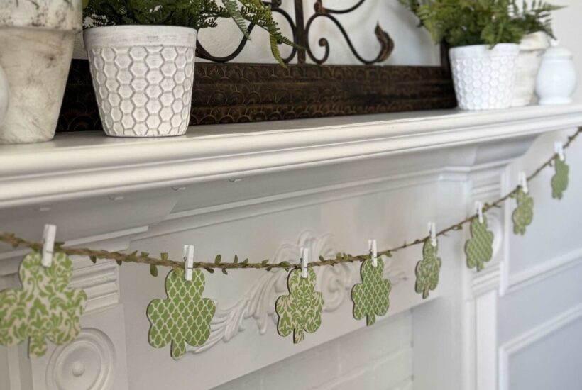 Shamrock garland hanging on a mantel.