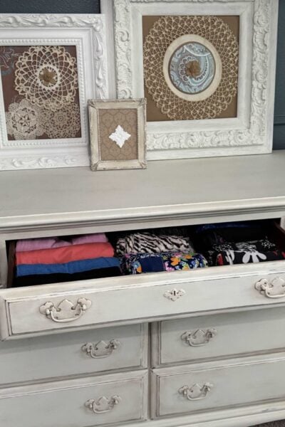 A dresser drawer with organized workout clothes.
