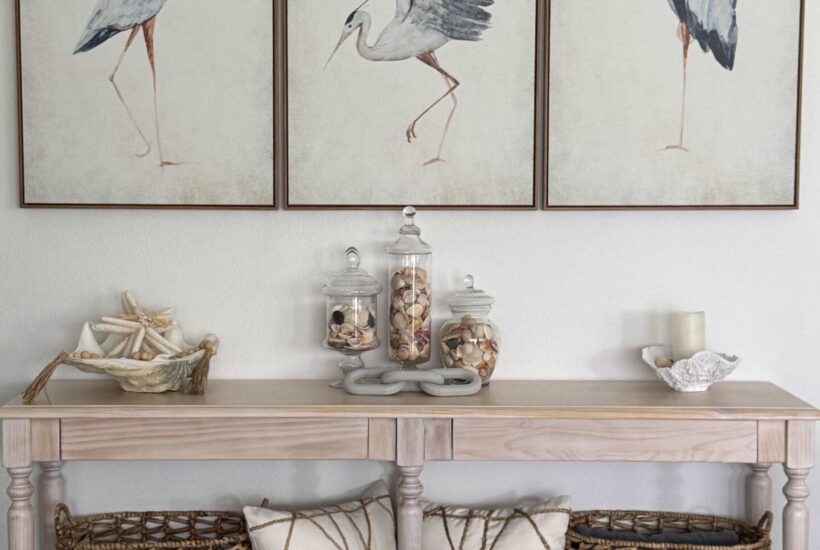 Three canvases with a different blue heron on each one.