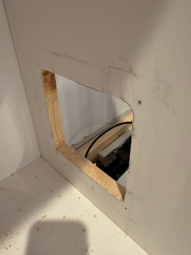 Rough cut out hole for access panel inside cabinet