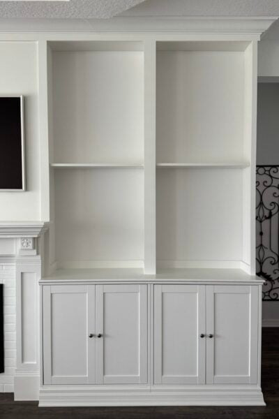 White built-in cabinets with bookshelves.