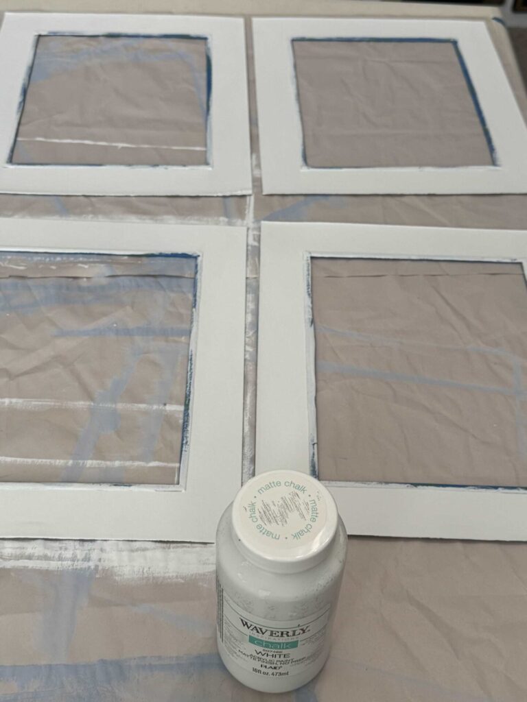 Four mats painted white. 