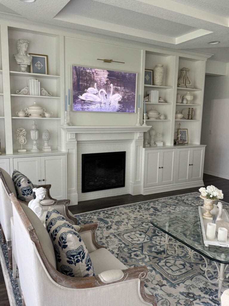 Blue and white living room makeover with built-in bookshelves and fireplace. 