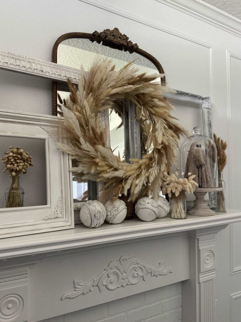 A mantel decorated for fall. 