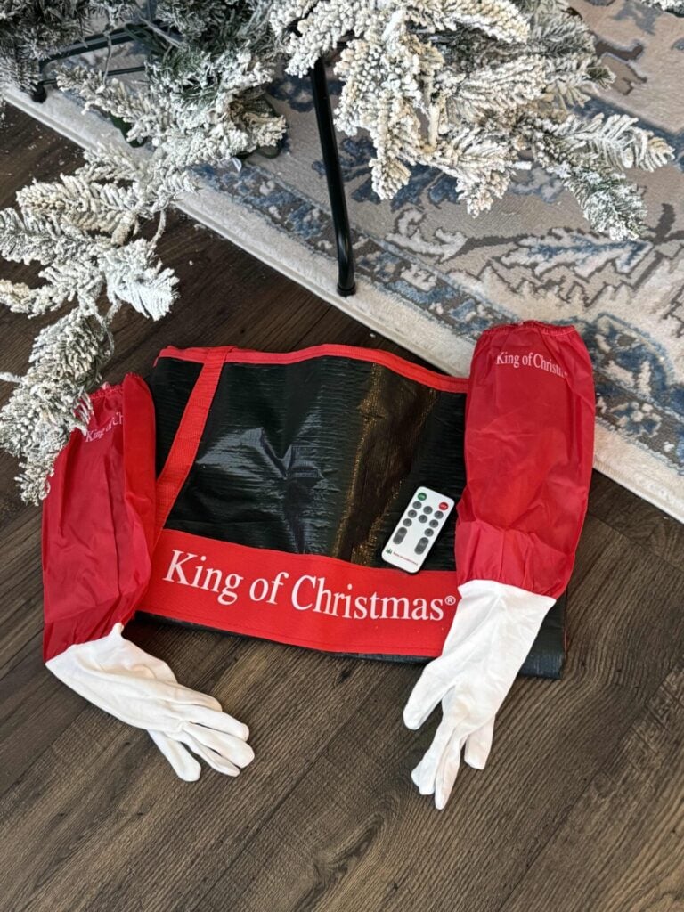 King of Christmas tree storage bag, fluffing gloves, and remote control for lights.