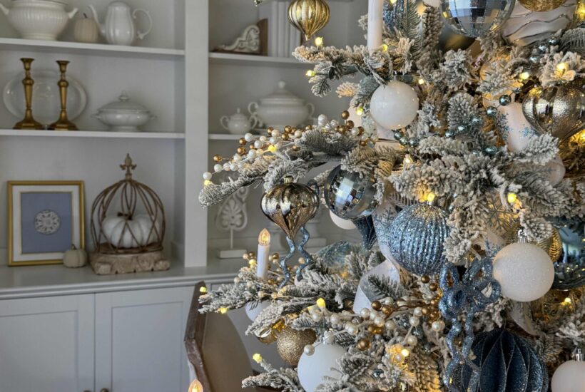 Decorated Christmas tree with blue, white, and gold ornaments